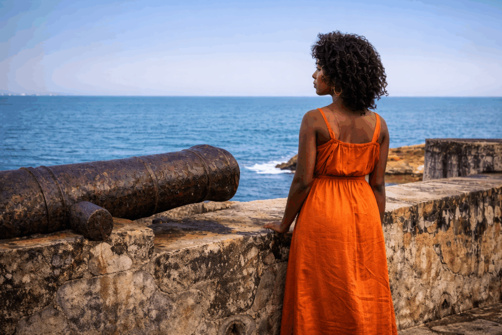African diaspora travel moment at Cape Coast Castle in Ghana overlooking the Atlantic Ocean