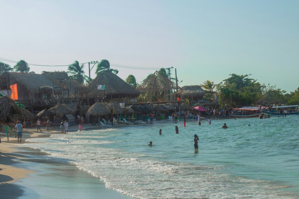 Caribbean beach near Cartagena, Colombia, with visitors and boats along the shoreline