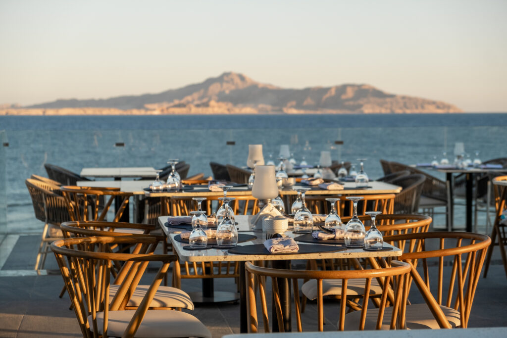 Outdoor restaurant tables overlooking the sea